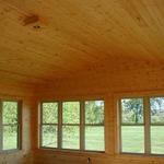 VIEW LOOKING OUT THE BACK OF THE 3-4 SEASON PORCH